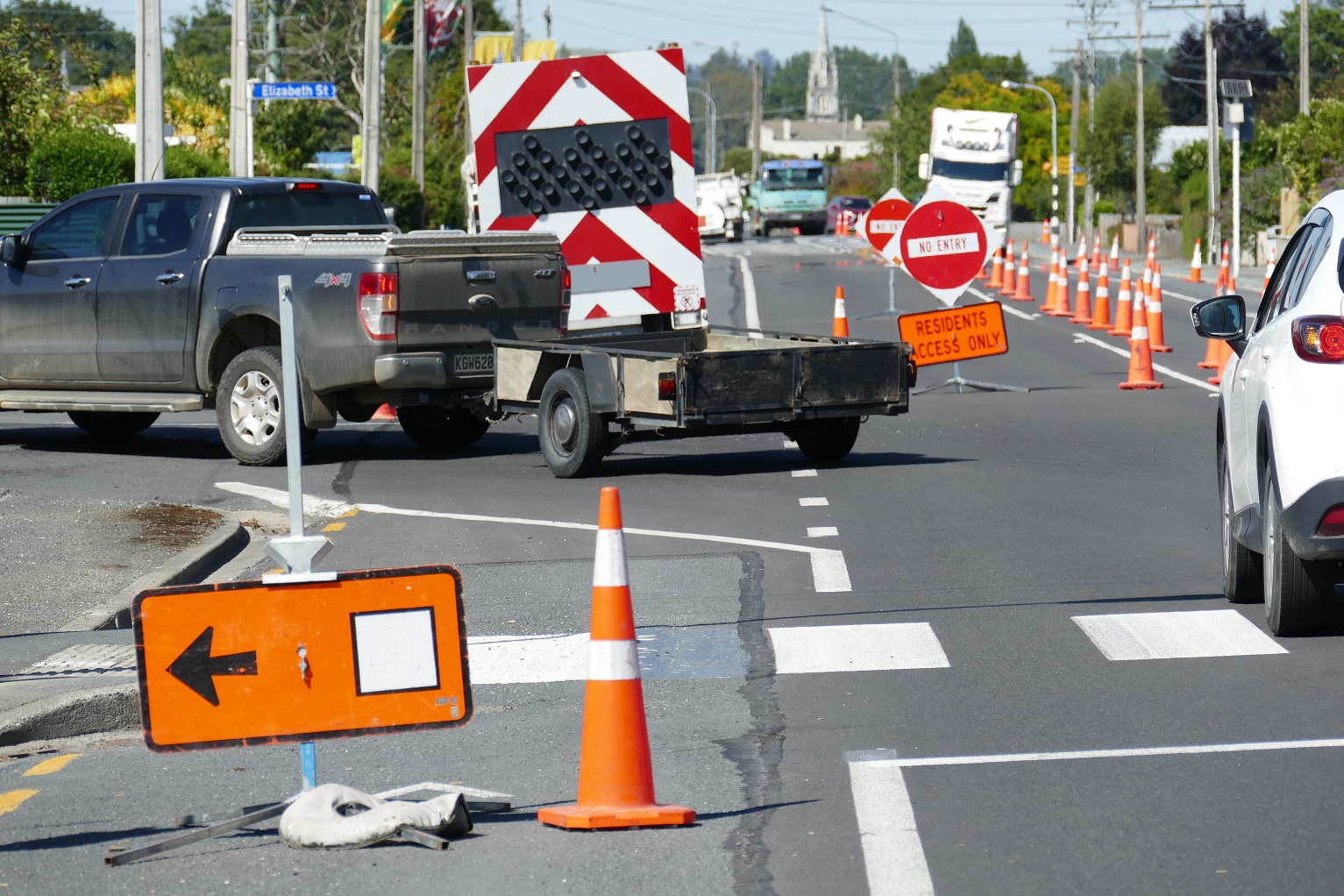 Cars travelling south on State Highway 1 in Milton take a diversion as extensive resealing works...