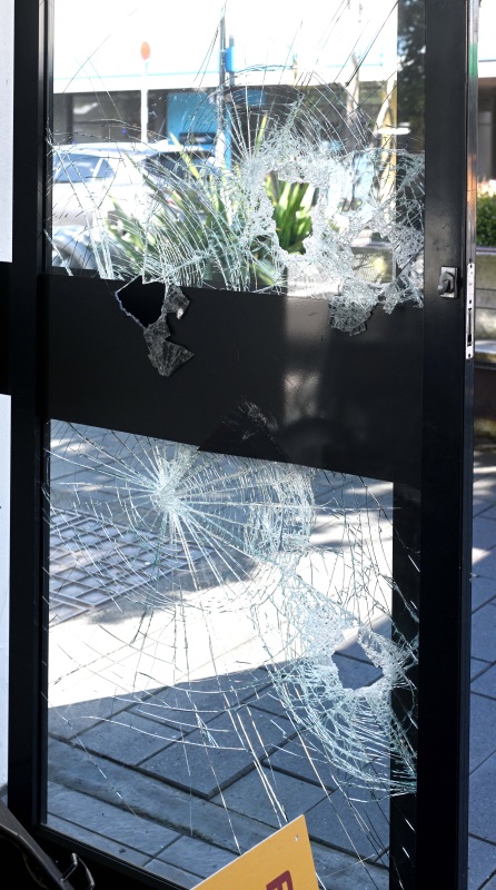 One of the smashed windows at Cash Converters in South Dunedin this morning. Photo: Gerard O'Brien