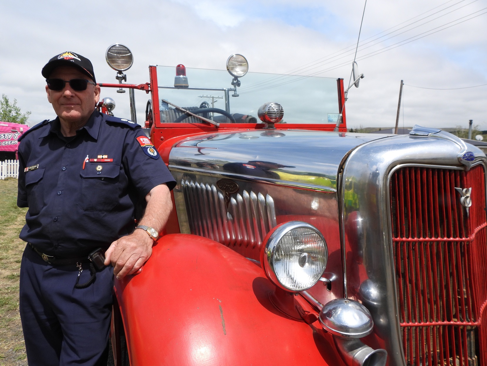 Kurow volunteering stalwart John Sturgeon at the wheel of the Kurow Volunteer Fire Brigade’s 1933...