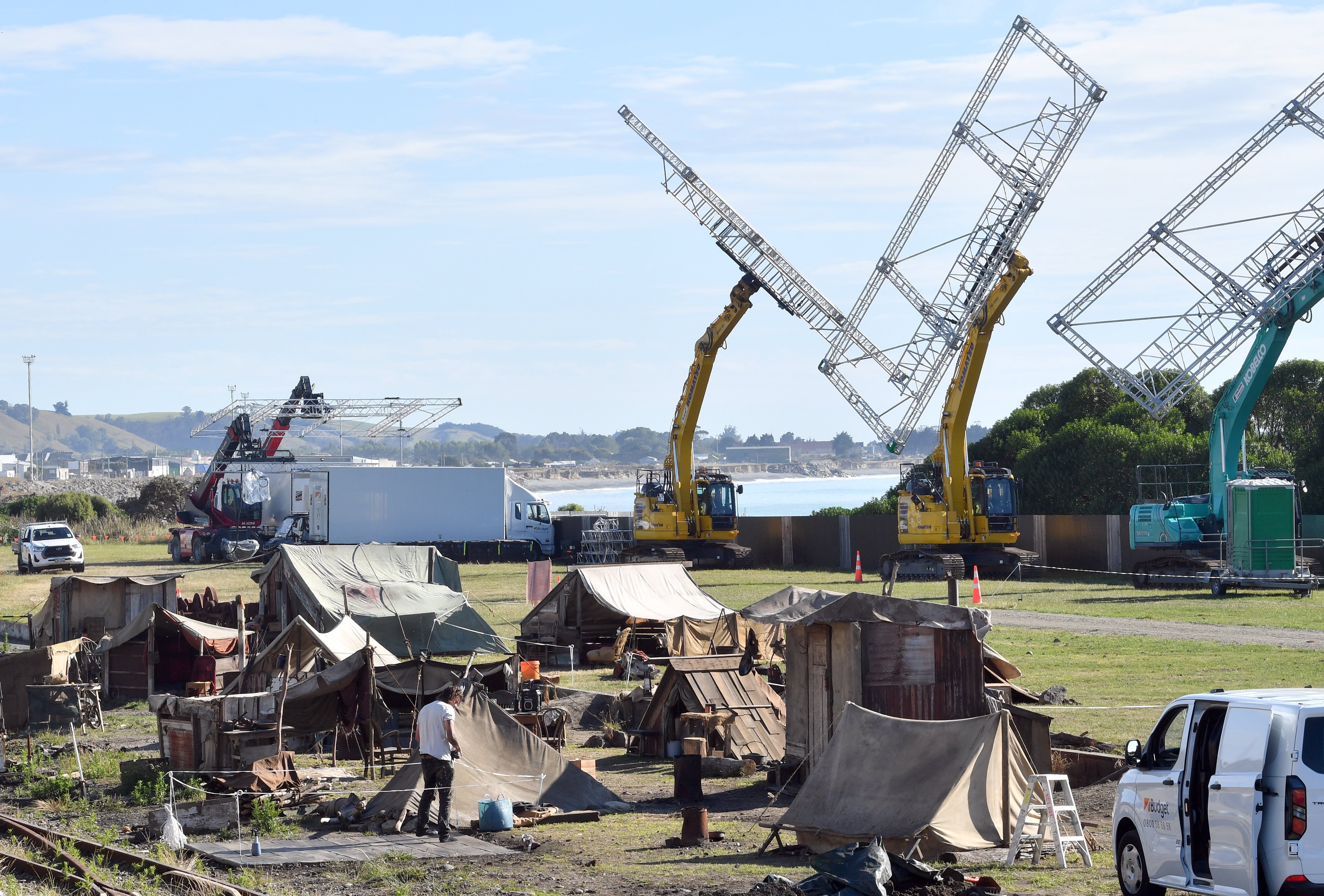 Mobile rigs, believed to be used for lighting and blue screens, loom above a set under...