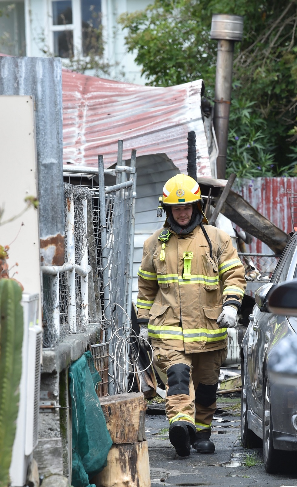 A firefighter leaves after helping extinguish the blaze.