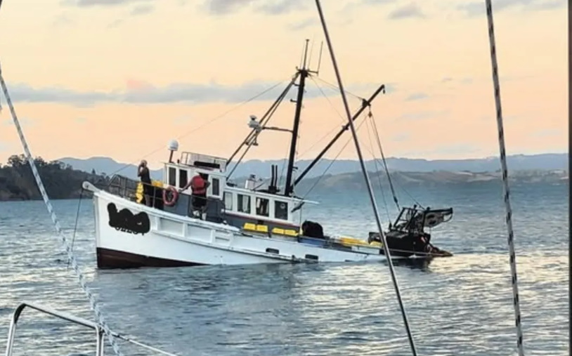 The fishing boat which two men were rescued from sinks in the Hauraki Gulf. Photo: Facebook/Kawau...