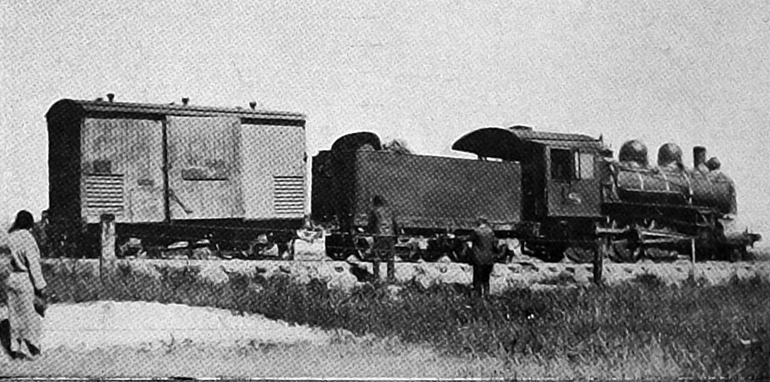 Passengers mill around a fruit wagon that partly derailed on the Otago Central railway line,...