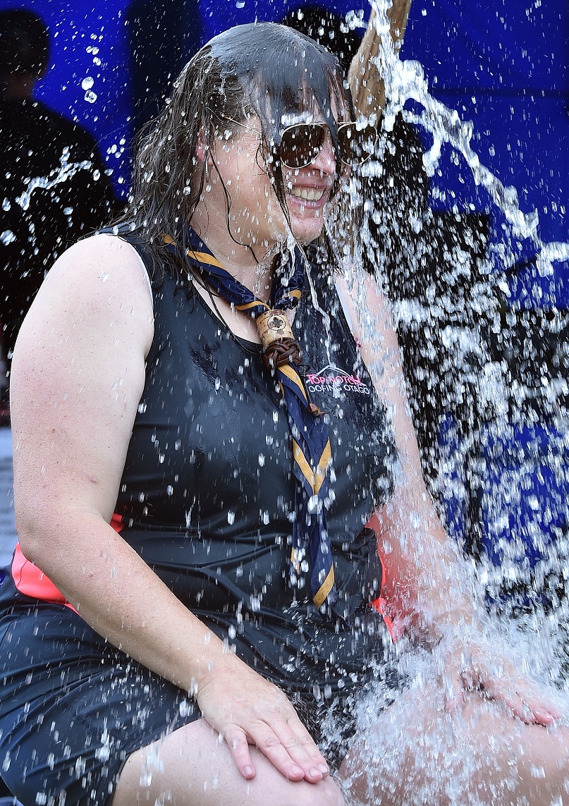 Sarah Leslie, of Mosgiel, is doused at the Mosgiel Scouts station.