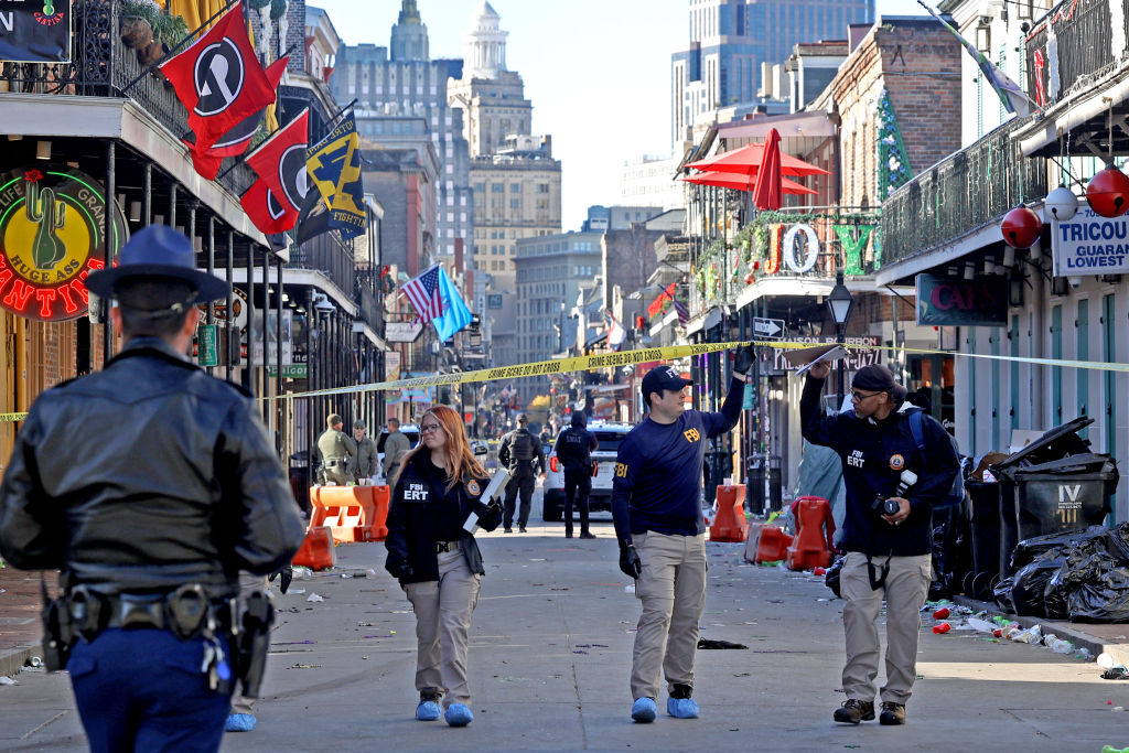 Law enforcement officers from multiple agencies work the scene on Bourbon St following the incident. Photo: Getty Images