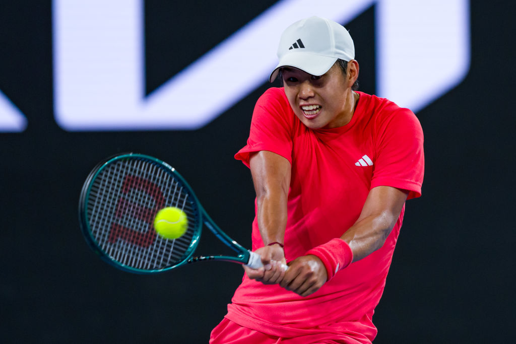 Learner Tien plays a backhand during his win over Daniil Medvedev last night at the Australian...