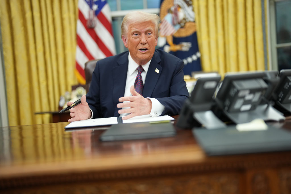 President Donald Trump signs a series of executive orders at the White House today. Photo: Getty...