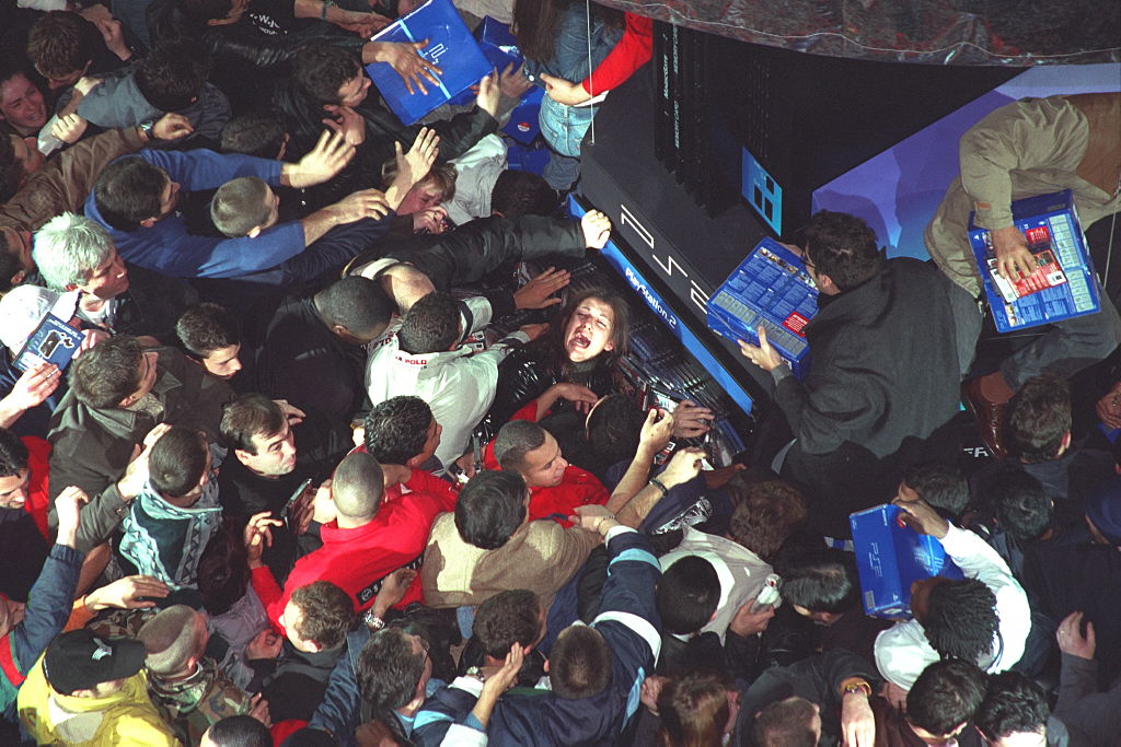 Shoppers push and shove during the launch of Playstation 2, at Paris’ Virgin Megastore, in...