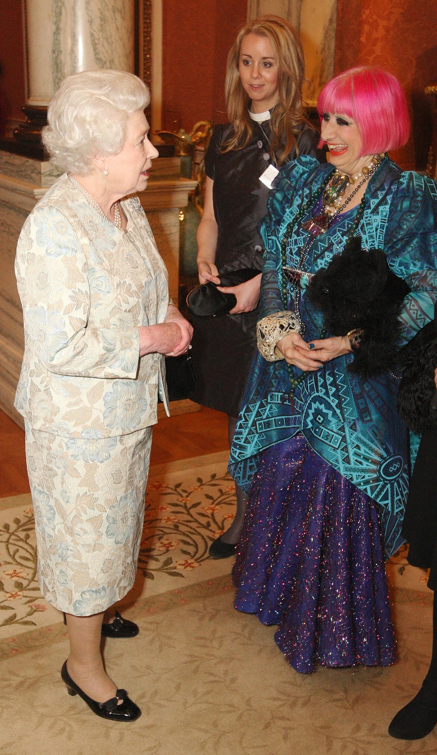 Rhodes meets the Queen at the British Clothing Industry Reception at Buckingham Palace. 