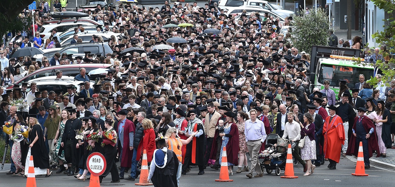 Graduands march to the Dunedin Town Hall for their capping ceremony. 