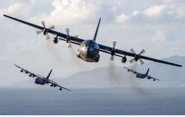 C-130H(NZ) Hercules aircraft from No.40 Squadron flying over the Auckland area with three MC-130J...