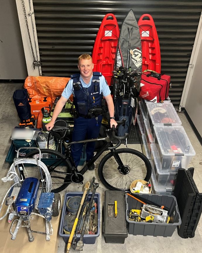 Constable Ashley Wilson with the recovered stolen property. Photo: Supplied/Police 