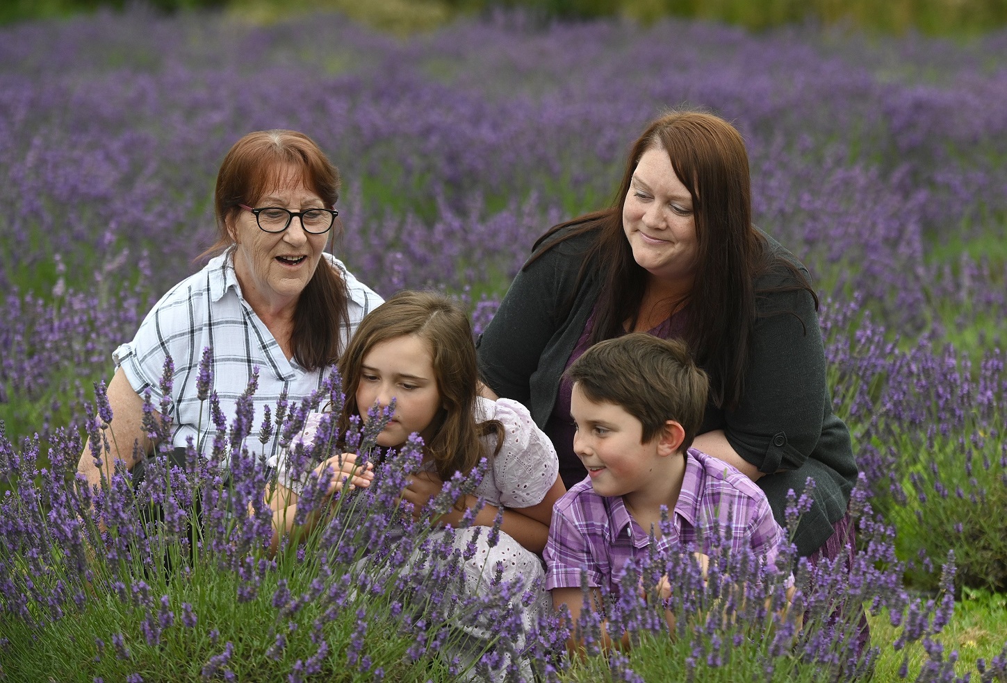 Taking in the perfume of the Lavender Row harvest day near Outram yesterday are Karen Kingsland,...