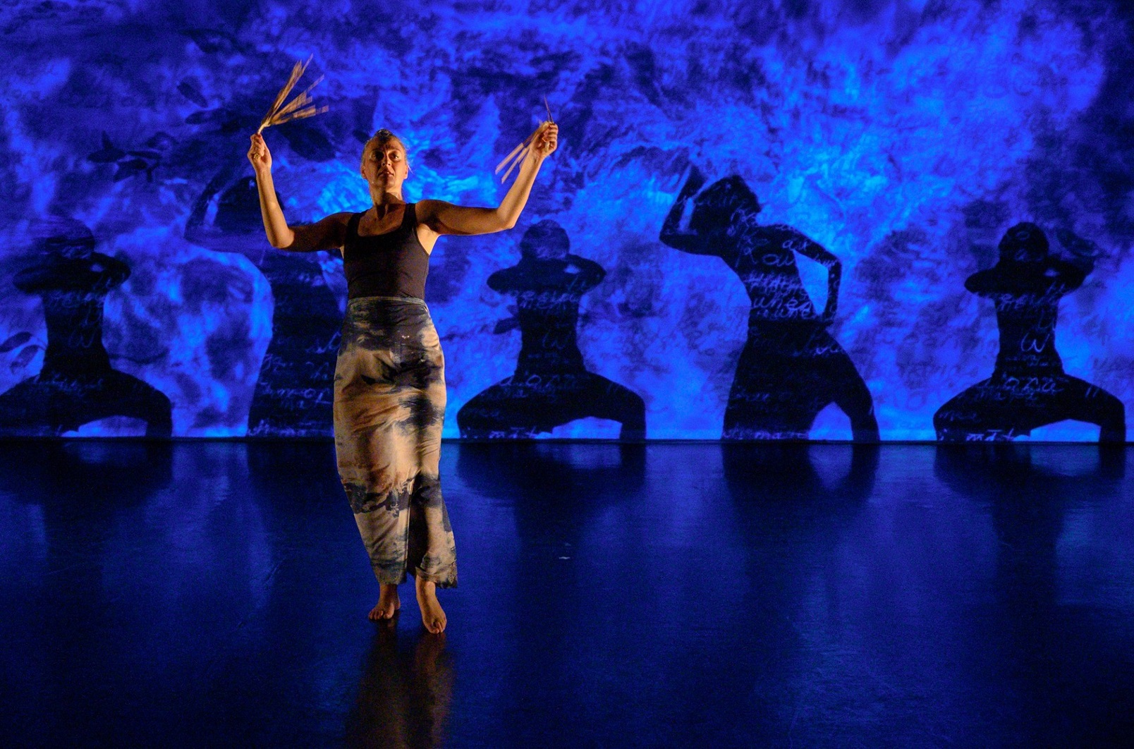 Louise Pōtiki Bryant performs Pūheke alongside versions of herself.