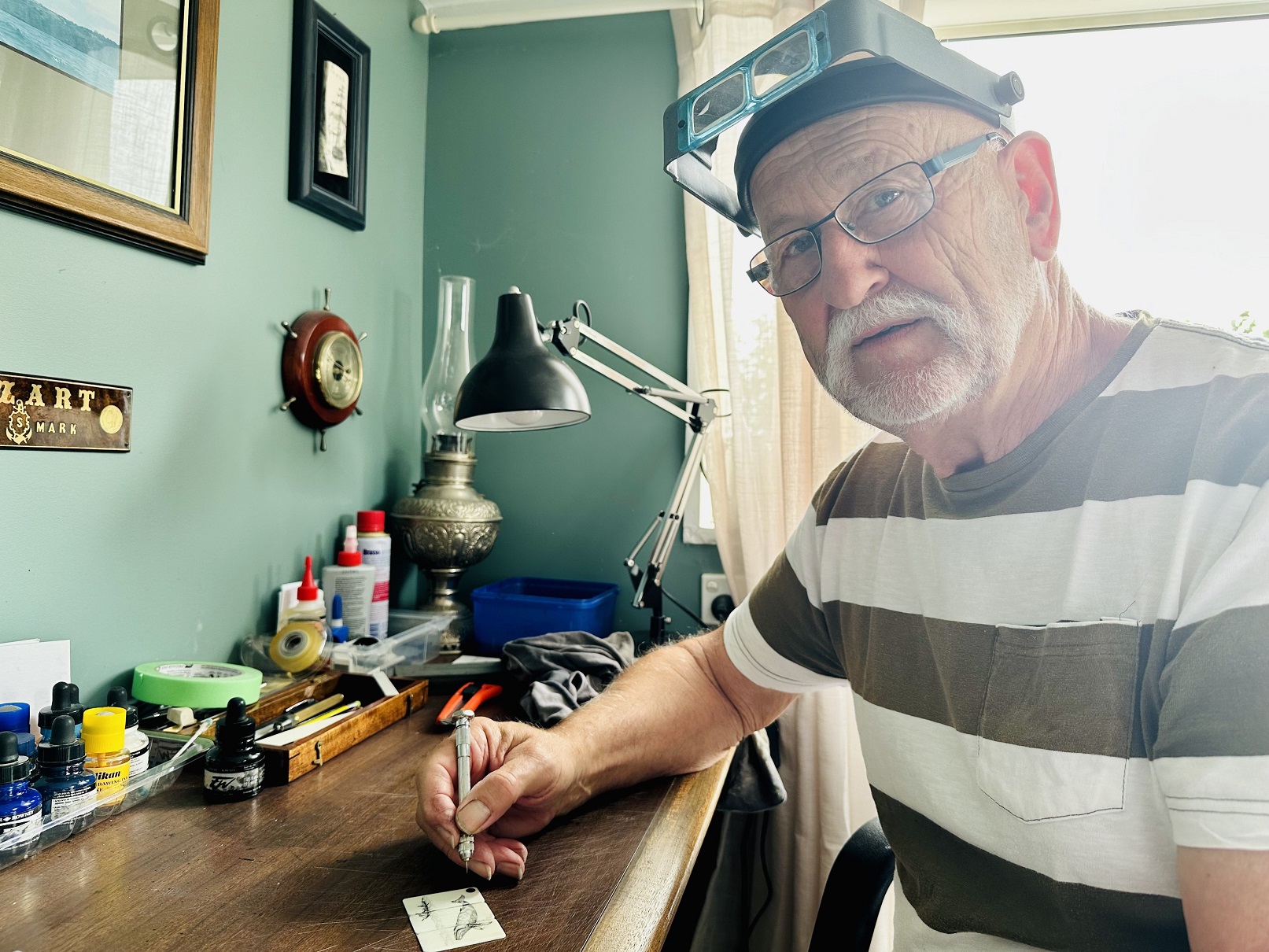 Gus Milne at work in his home studio at Mt Pleasant, Christchurch.