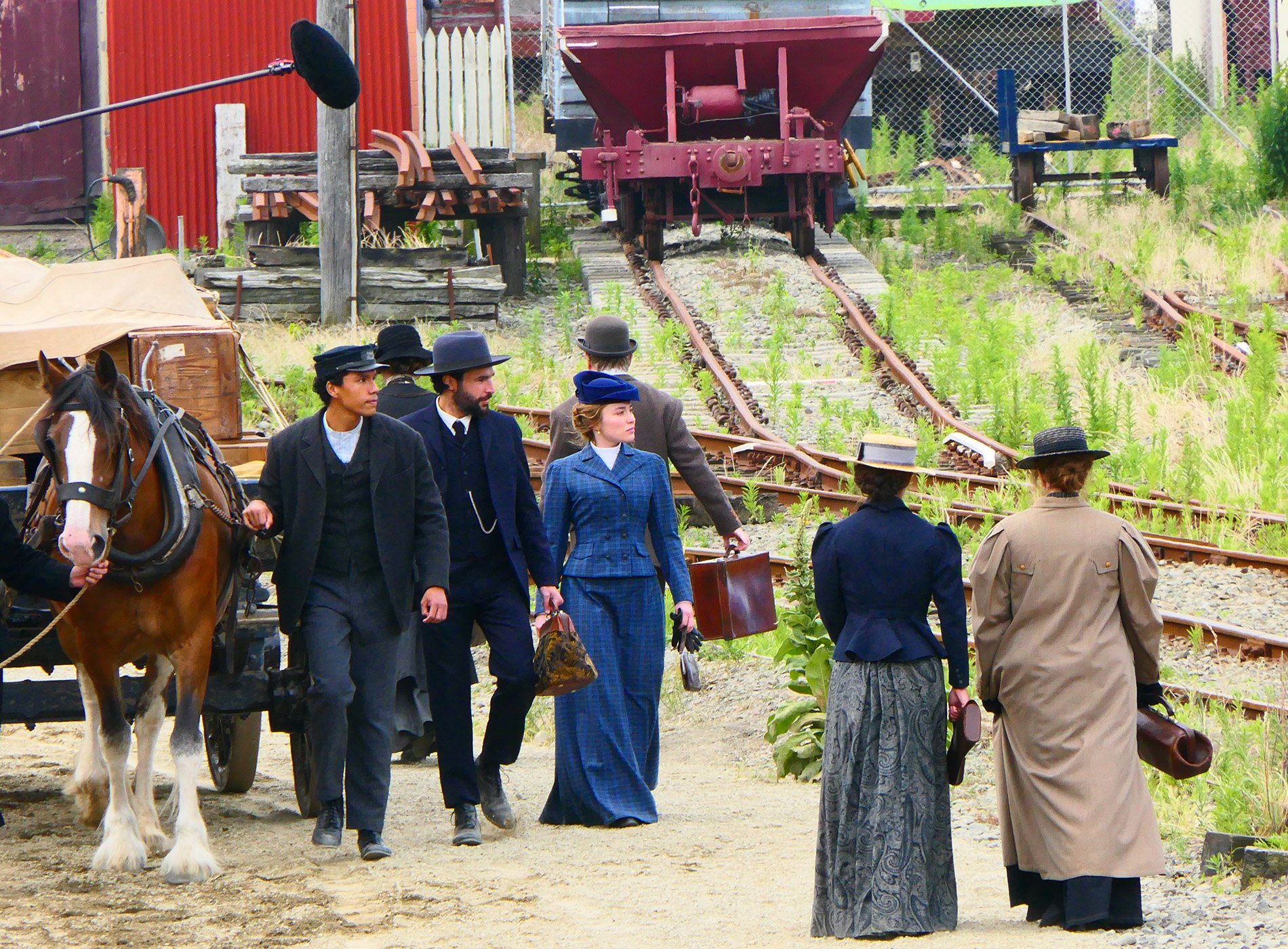 Hollywood actress Florence Pugh (centre, in blue), in character as Cathy Ames, walks beside actor...