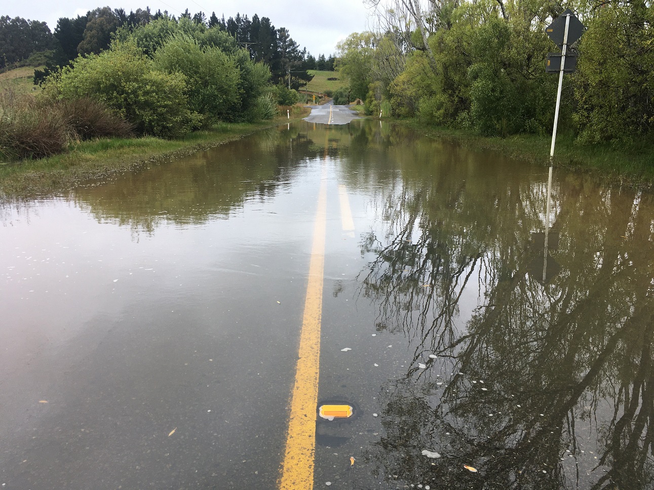 Surface flooding yesterday temporarily closed Old Brighton Rd between Fairfield and Waldronville....