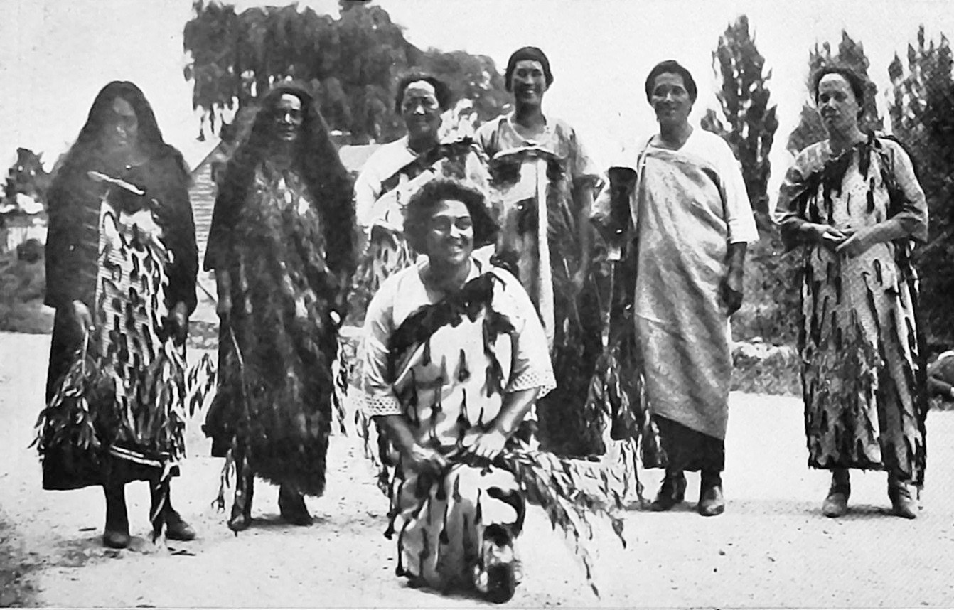 Kaikaranga wave willow foliage as they chant welcoming greetings to Judge Jones of the Native...