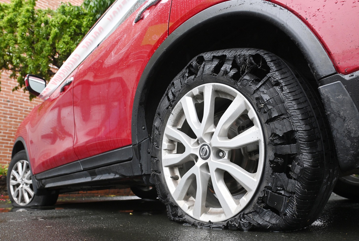 The shredded tyre of a Nissan X-Trail after it was spiked in Forbury Rd yesterday. Photo: Gerard...