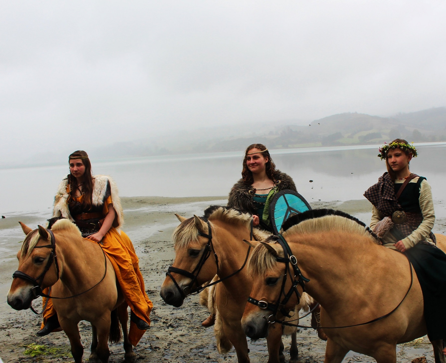 Norwegian fjord horse lovers (from left) Olive Ward, June Ward and Zoe Evens wear Viking garb and...