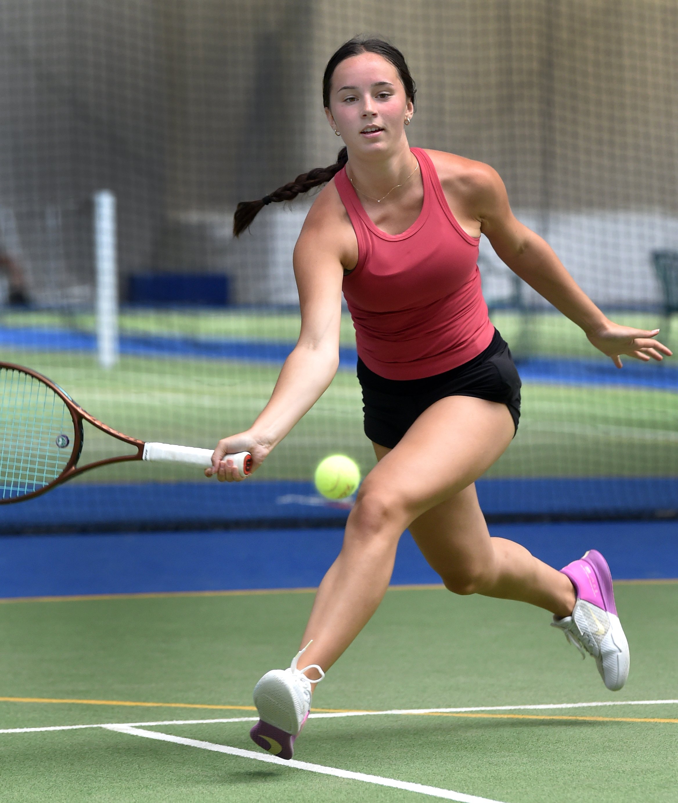 Erin O’Neill stretches to return a shot during the Otago Open women’s singles final at the Edgar...