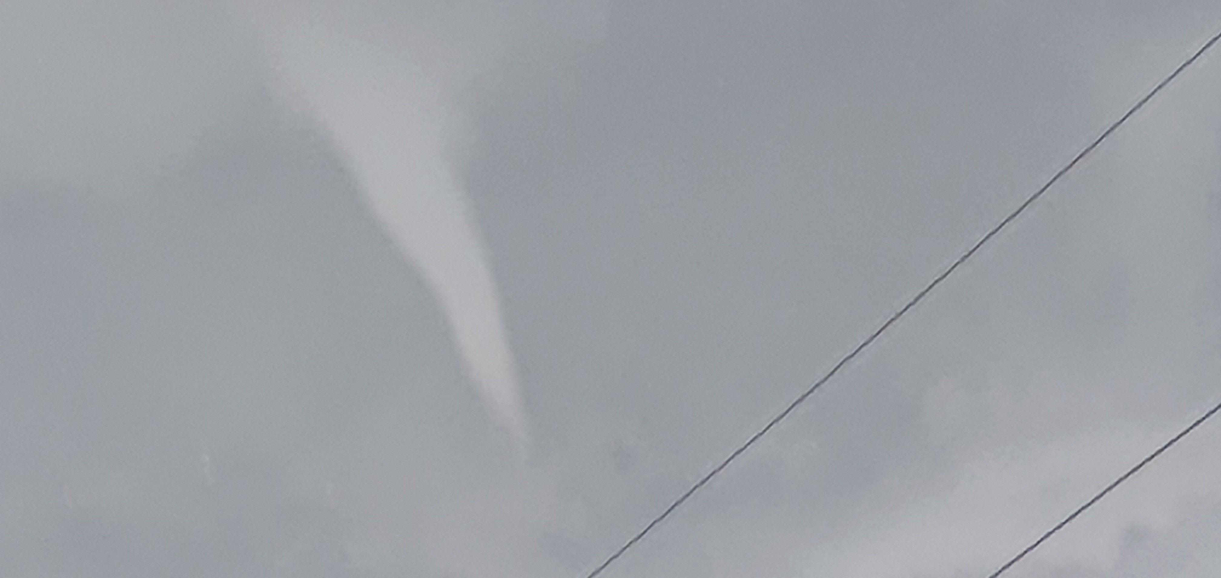 A funnel cloud appeared over Omakau on Thursday afternoon. Photo: supplied/Adam Rubie