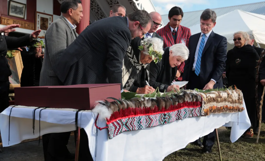 Tariana Turia (right) signs Whanganui River Treaty settlement in 2014 as Treaty Negotiations...