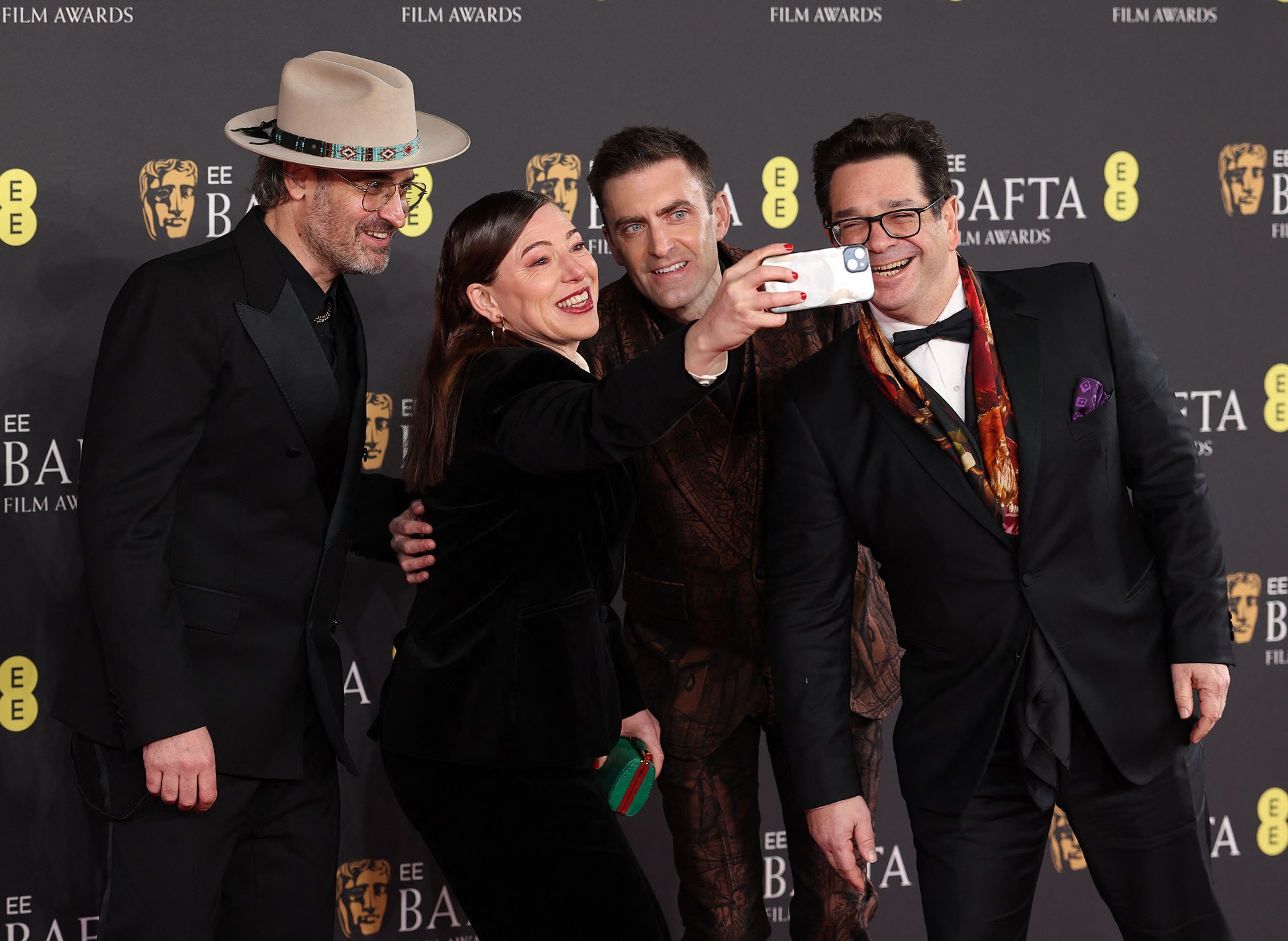 Lizzie Gillett takes a selfie with her fellow producers and co-directors (from left) Ian Bonhote,...