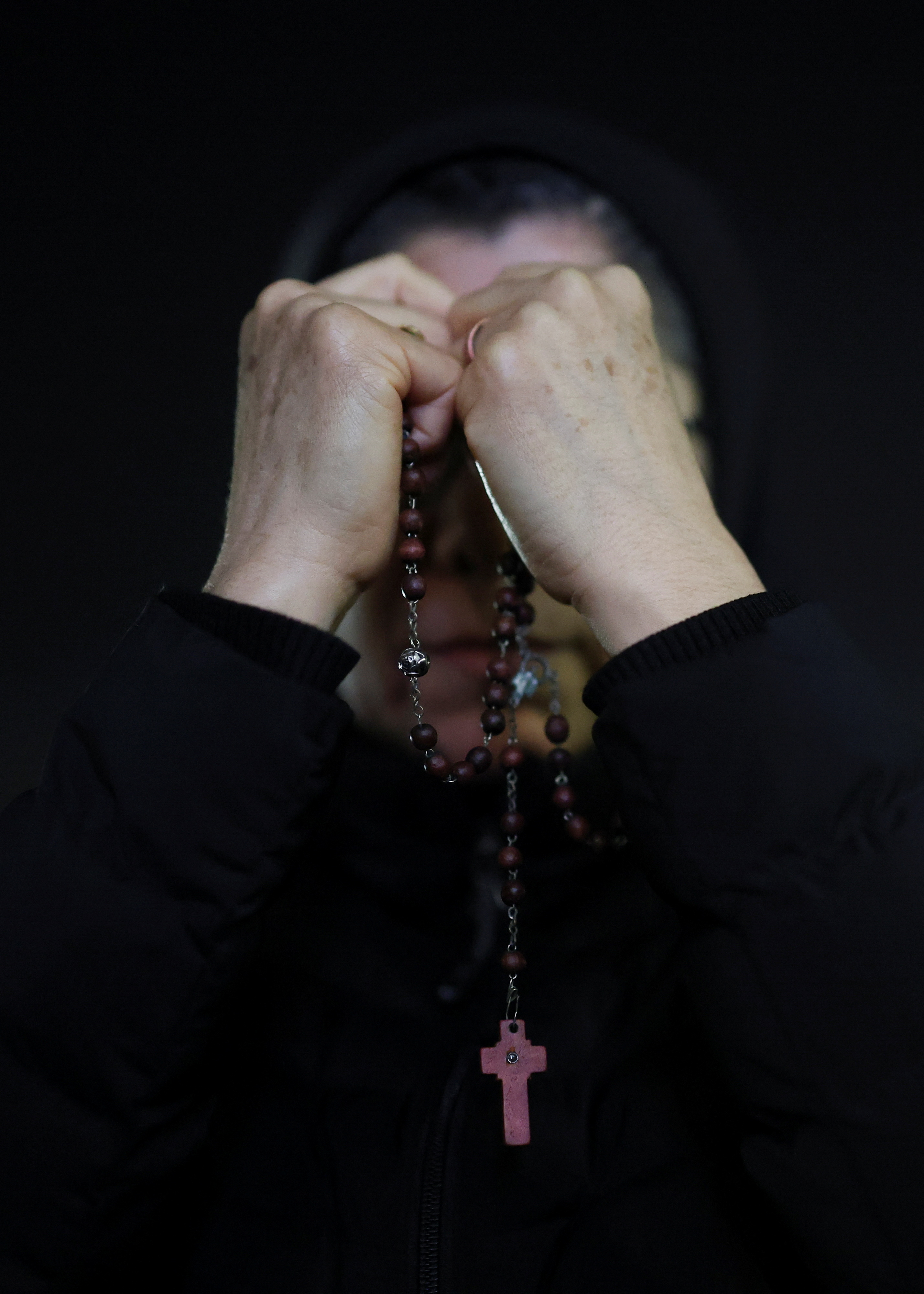 A woman prays for the Pope at a service in St Peter's Square. Photo: Reuters 