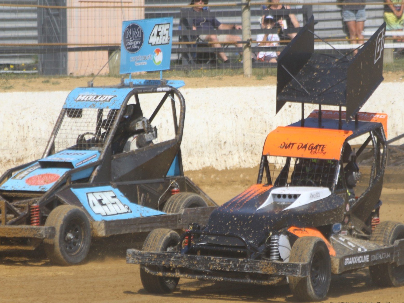 Zach Newsham makes a pass on the inside of Christchurch's Luke Molloy in the Southland Stockcar...