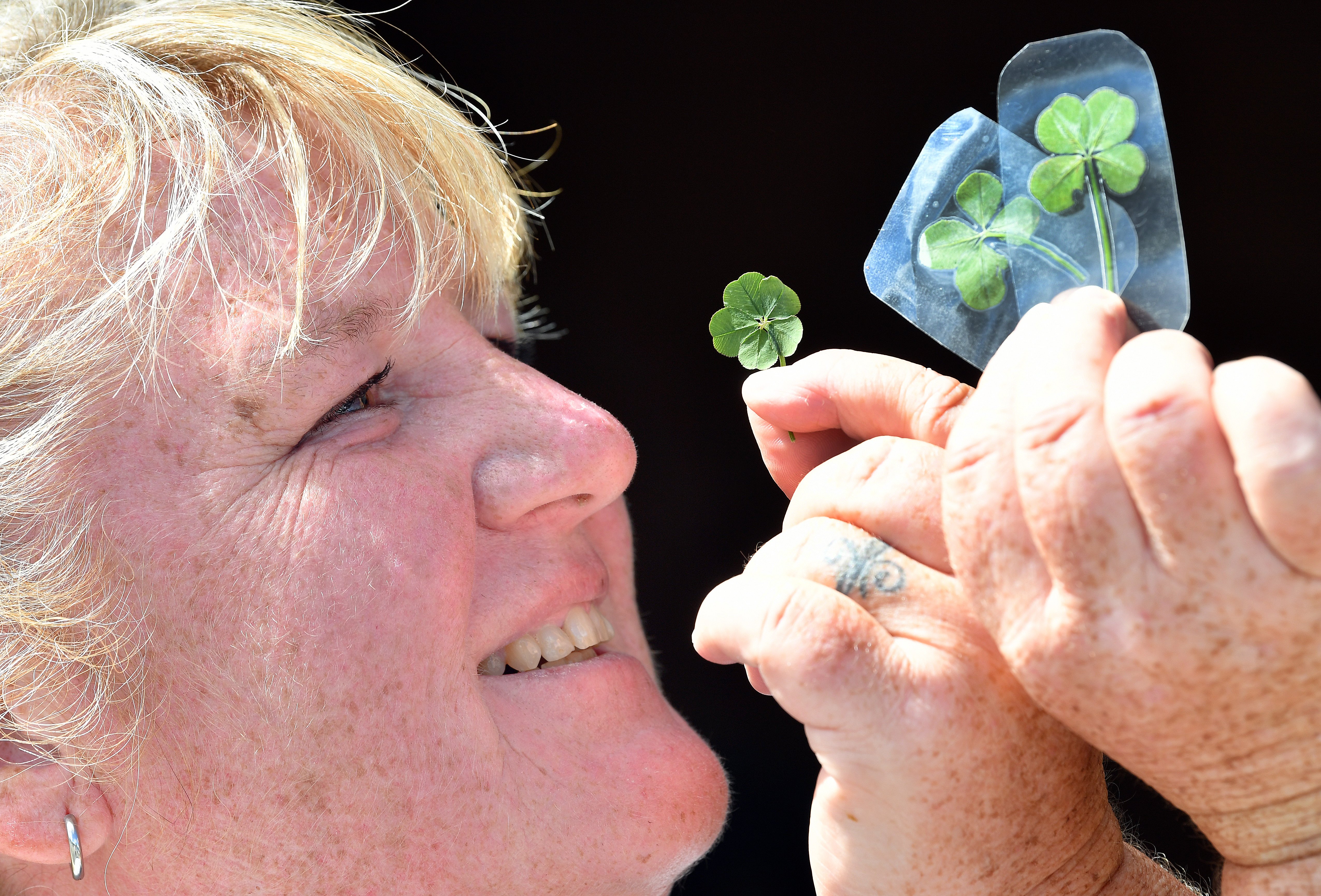 Erin Kealey, the owner of perhaps the luckiest lawn in North Taieri, shows off her latest haul of...