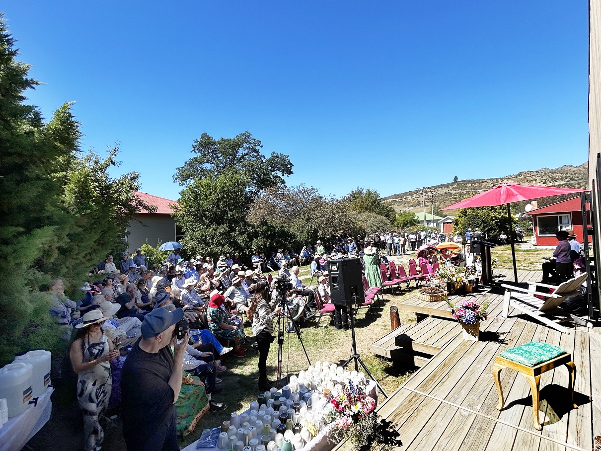 Mourners pack the garden of author and poet Brian Turner yesterday for his funeral service....