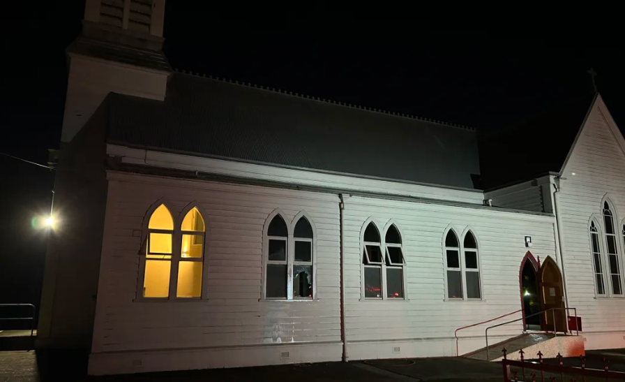 Flames can be seen in the dark through the windows at this Masterton church. Photo: Supplied/...