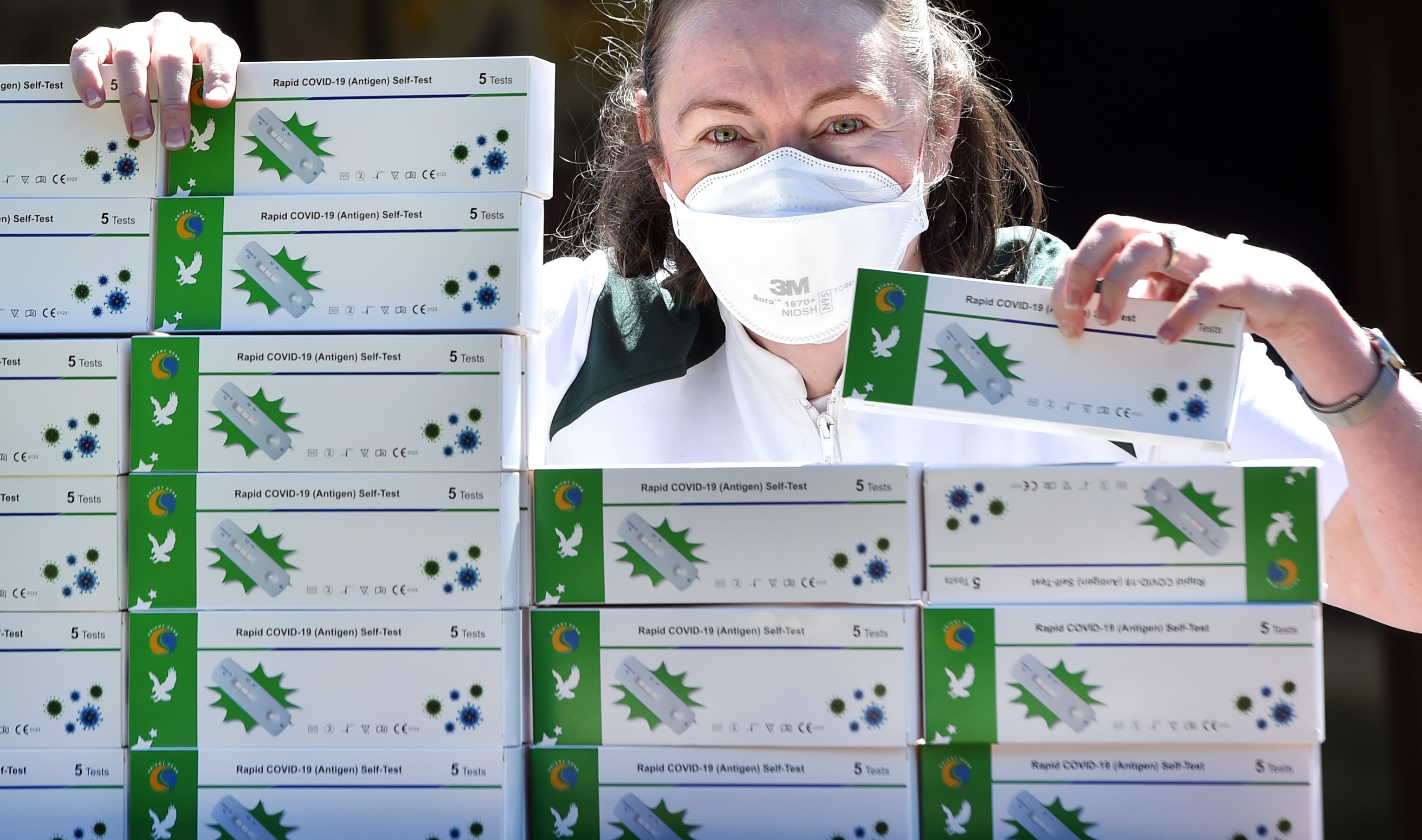 Pharmacist Leigh Ribeiro with Rapid Covid-19 self tests at Roslyn Pharmacy. PHOTO: PETER MCINTOSH