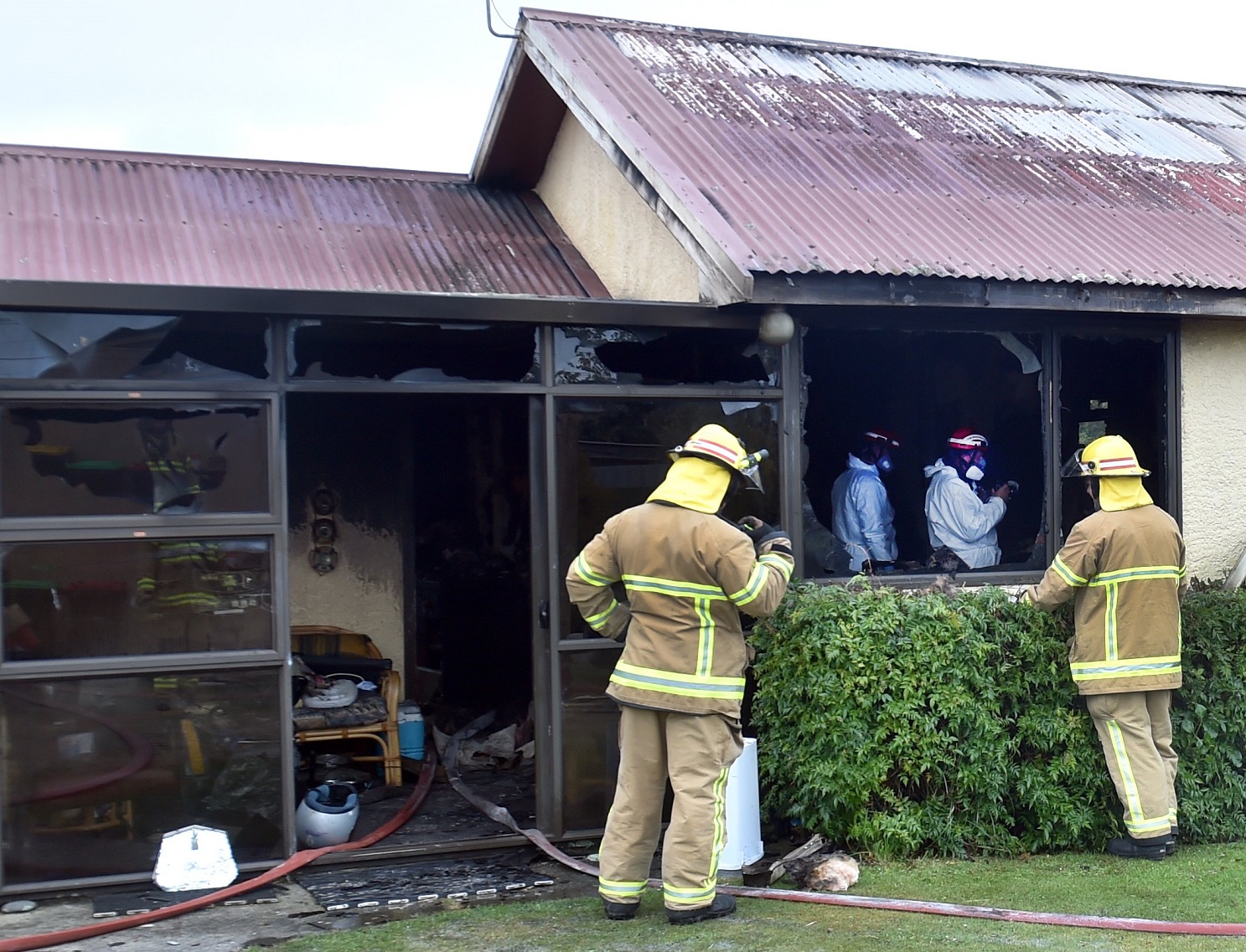 Fire and Emergency New Zealand fire investigators work to determine the cause of a large blaze...