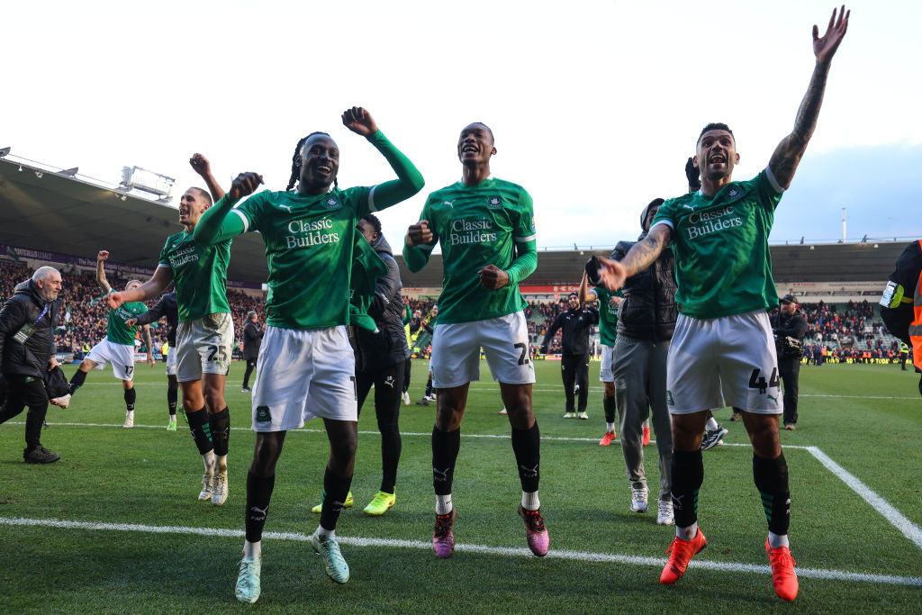 Malachi Boateng, Muhamed Tijani and Victor Palsson of Plymouth Argyle celebrate during their win...