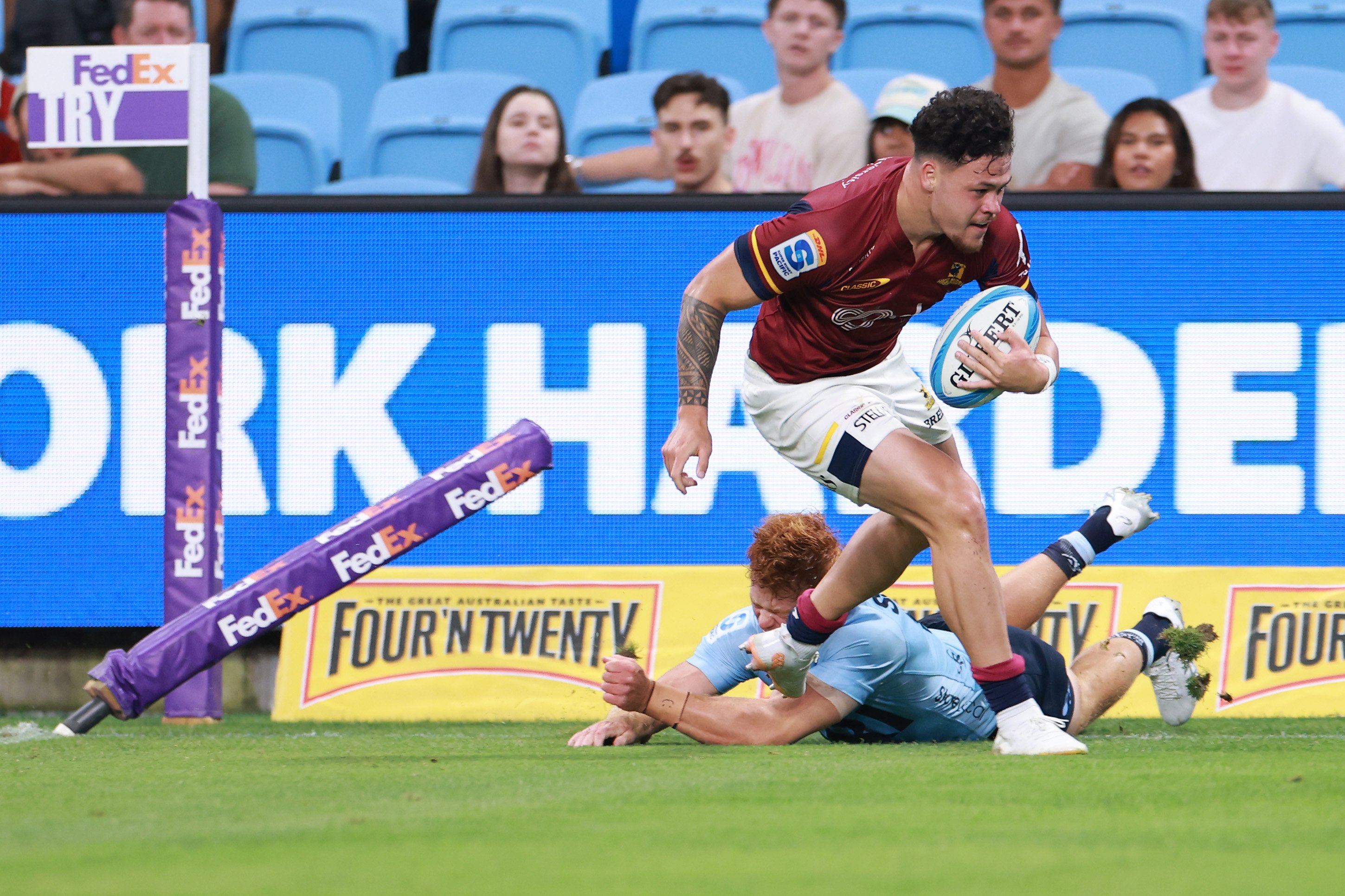 Highlanders winger Caleb Tangitau scores during his side’s Super Rugby Pacific match against the...