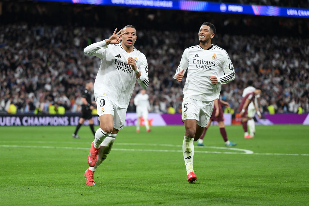 Kylian Mbappe celebrates his third goal alongside Jude Bellingham during Real Madrid's win over...