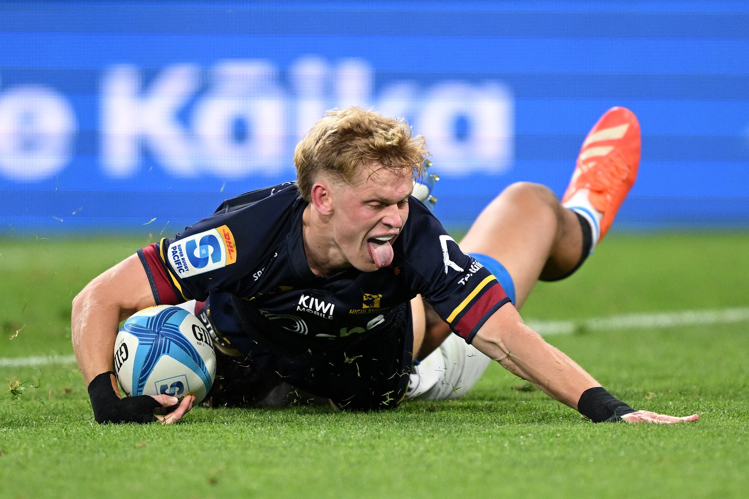 Highlanders fullback Finn Hurley reacts after scoring one of his two tries against the Blues on...