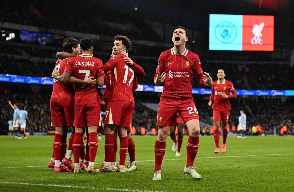 Andy Robertson celebrates in front of the Liverpool fans as Dominic Szoboszlai, Luis Duiz and...