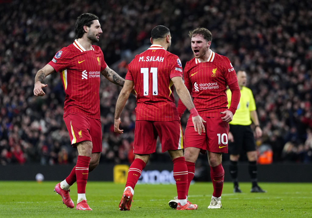 Alexis Mac Allister (right) celebrates with Dominic Szoboszlai and Mo Salah during Liverpool's...