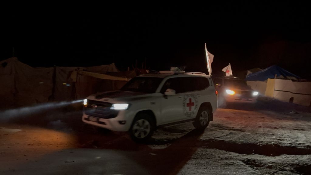 Red Cross vehicles, carrying the bodies of four Israeli hostages, leave pickup point after Hamas...