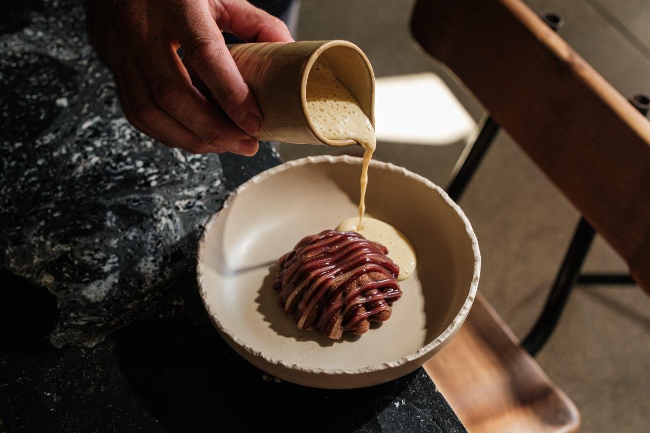 Cacao-free chocolate fondant, tea flower kombucha, black current jam, creme anglaise.