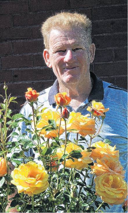 Canterbury Rose Society president Michael Brown, of Loburn, alongside Candy Crush, a rose he and...