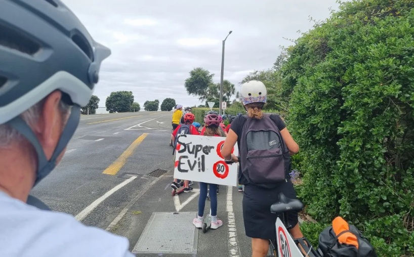 Clifton Terrace School pupils who bike and scooter to school, with signs protesting the speed...