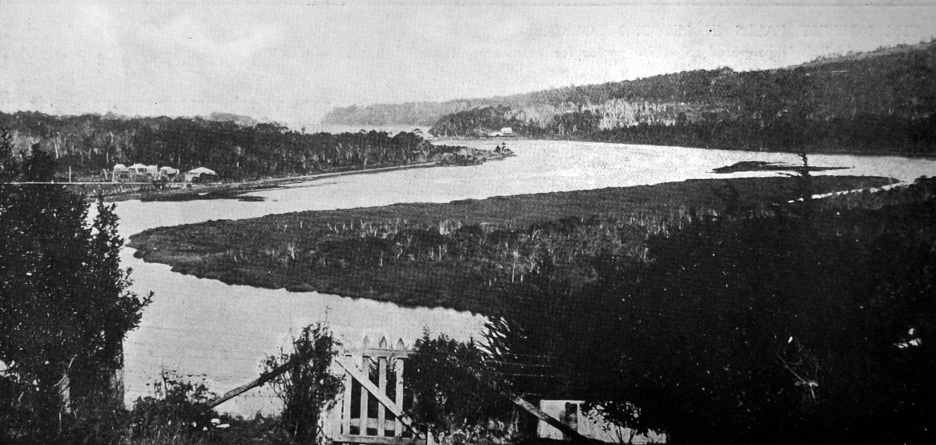 The river junction where the Tahakopa and Maclennan Rivers join. Papatōwai is in the distance. —...