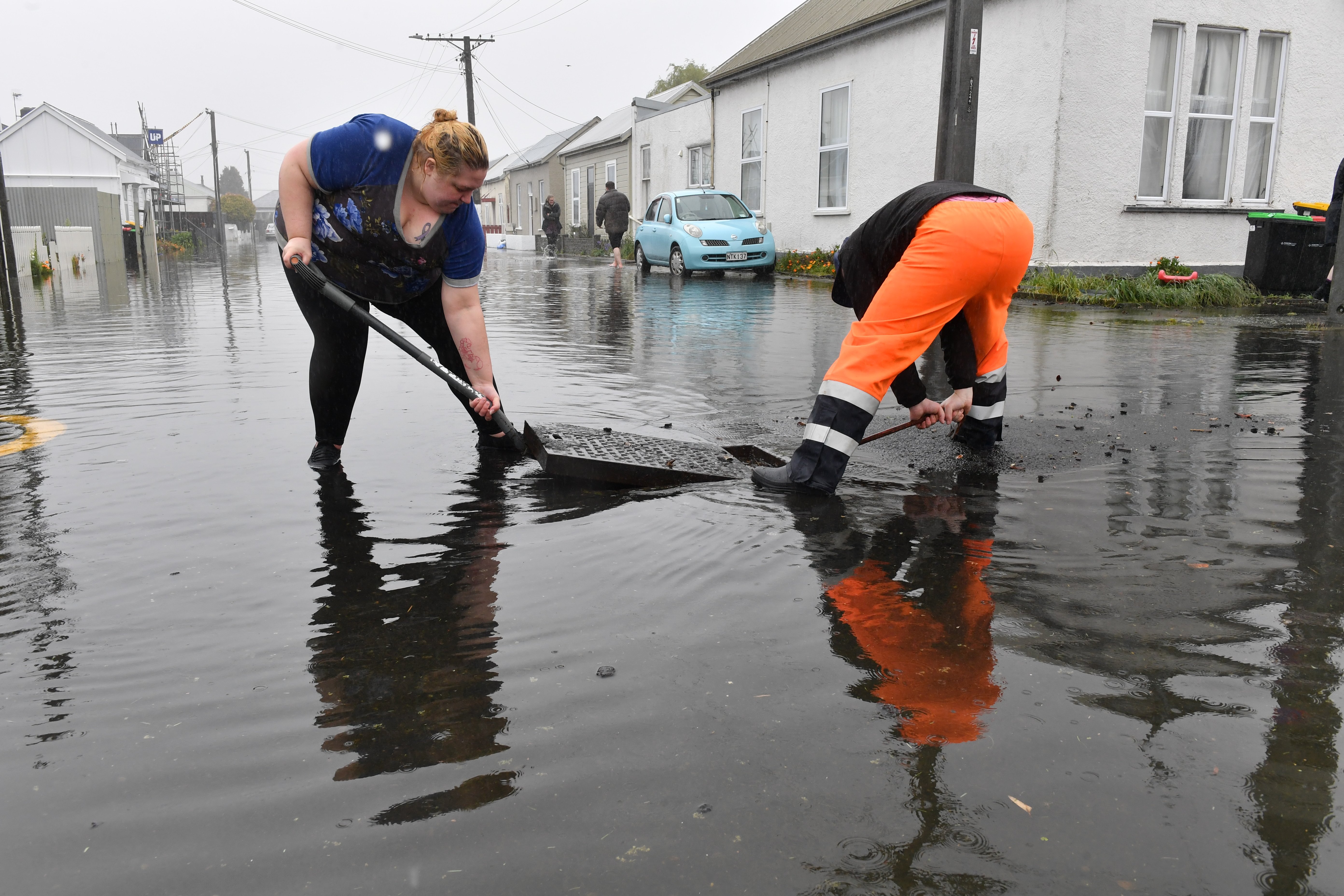 Cleaning up in South Dunedin after last year's flooding. Photo: Stephen Jaquiery