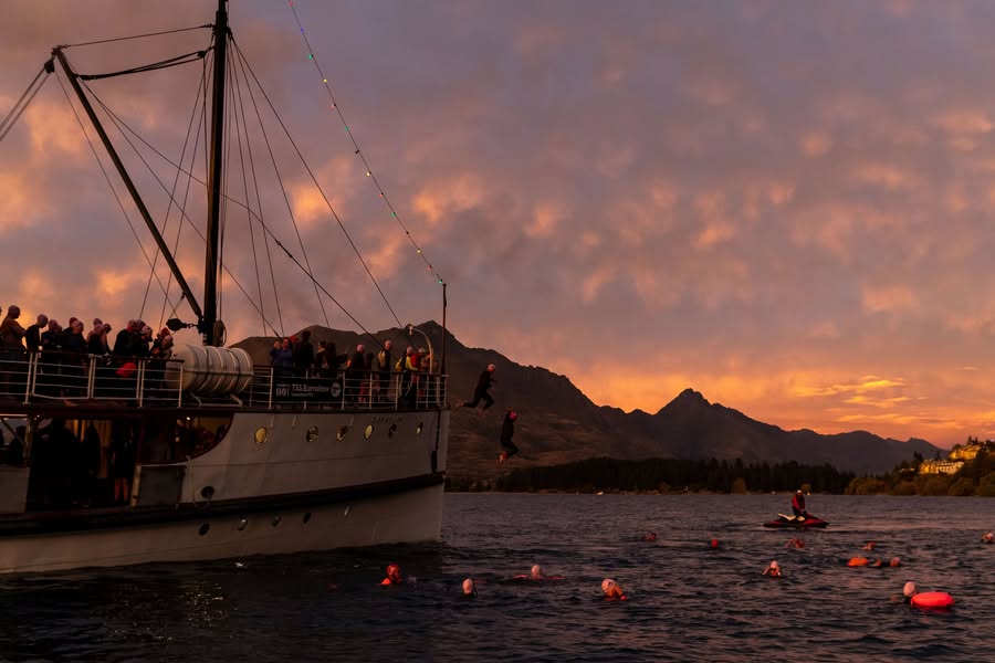 Legend swimmers come off TSS Earnslaw into Lake Wakatipu on Saturday morning. Photo: supplied