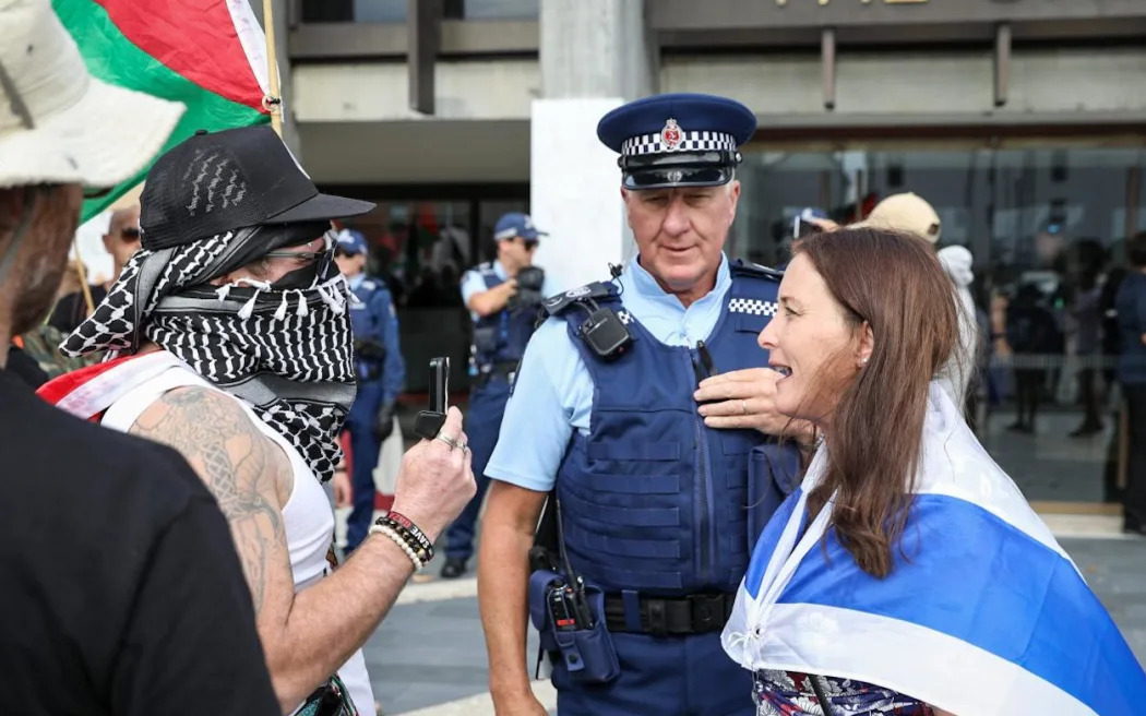 Protesters and counter-protesters outside the Christchurch Town Hall today.