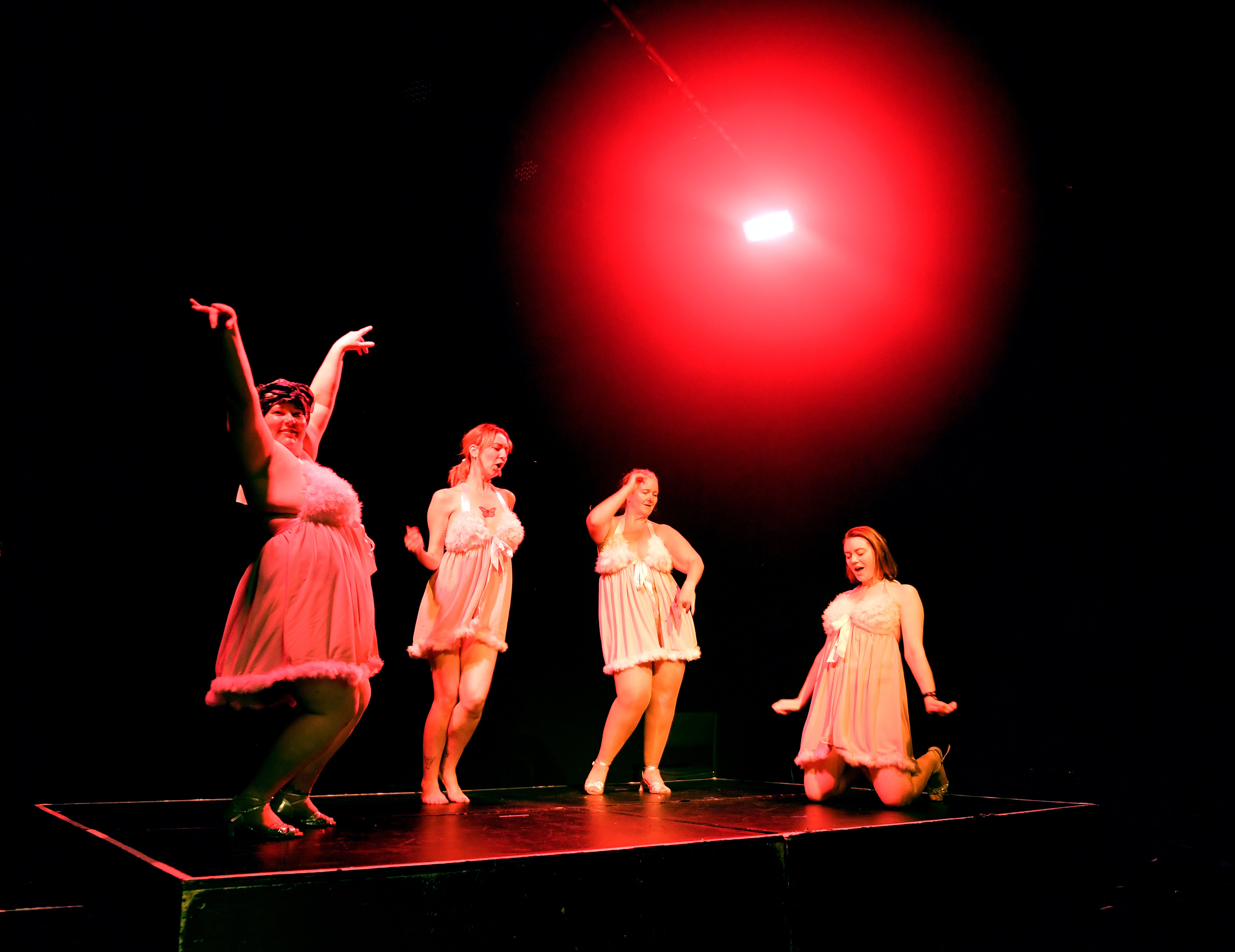 Performers pose on stage during a dress rehearsal ahead of the opening night of Burly Q, at this...